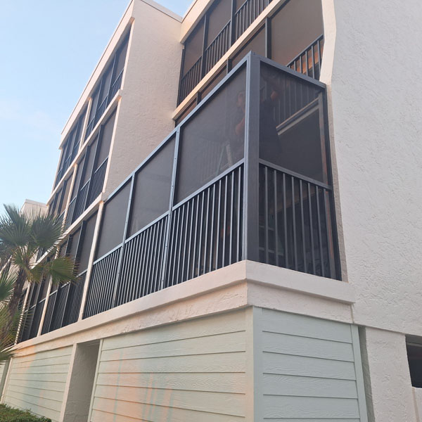 Branching Out Construction custom screen room for a balcony